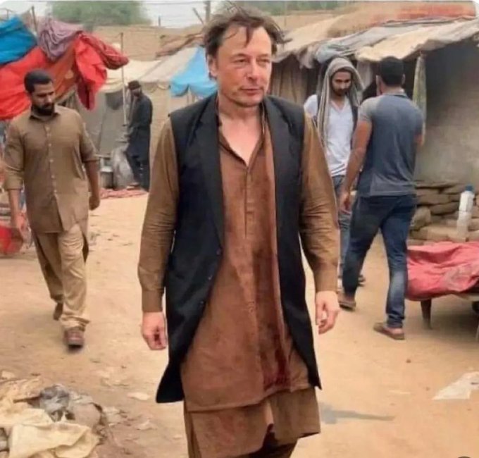 A man with Elon Musk's likeness wearing tattered traditional clothing walks through a dusty makeshift camp, with other similarly dressed people in the background. The image humorously illustrates the post's joke about Elon Musk's financial downfall had he invested in crypto and NFTs, depicting him as impoverished in a rural setting.
