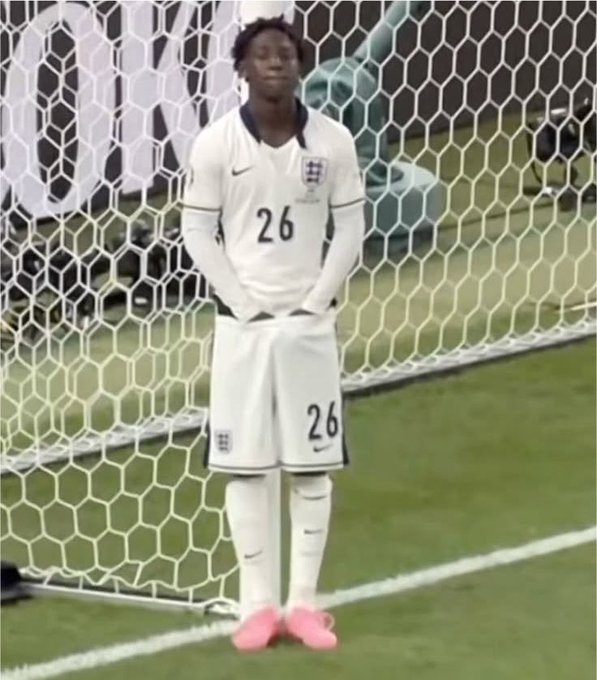 A soccer player wearing a white jersey with the number 26 stands in front of a goal net, paired with a reflective weekend message about finding peace. The player's calm, hands-clasped posture mirrors the post's theme of inner tranquility and contentment.