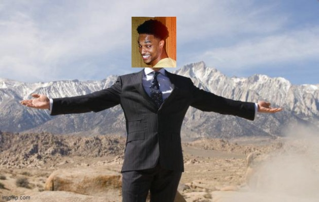 A man in a suit with a smiling face edited onto his head stands triumphantly with arms outstretched in front of a majestic mountain backdrop, visually capturing the post's celebratory tone about profiting from $ANSEM airdrops and meme coin gains.