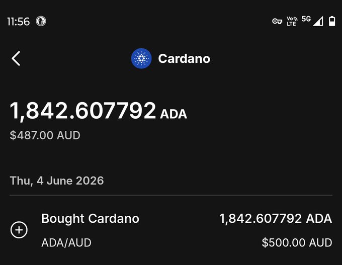 The image shows a screenshot of a cellphone screen displaying information about currency exchange rates, specifically for Cardano tokens. The caption associated with this image reads "Cheapest $ADA I've ever bought. If I could manifest more fiat right now I would buy literally as much as possible". This text implies that the user is in the process of exchanging their tokens for US dollars and has made a significant purchase using those tokens, possibly during a transaction at an unfavorable exchange rate. The exact amount spent cannot be determined from the image alone but is likely considerable due to the large number written on the screen representing the currency conversion result.