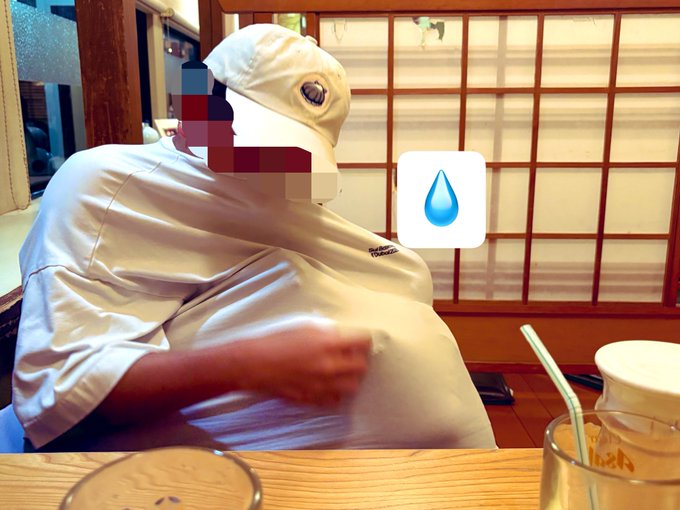 A person wearing a white cap sits at a Japanese izakaya with a relaxed posture, a "💧" water droplet emoji placed humorously over their chest area, suggesting they may have overdone it on the drinks. The traditional shoji screen and wooden interior evoke the nostalgic atmosphere mentioned in the caption about reminiscing over last year's Sui Basecamp in Dubai.