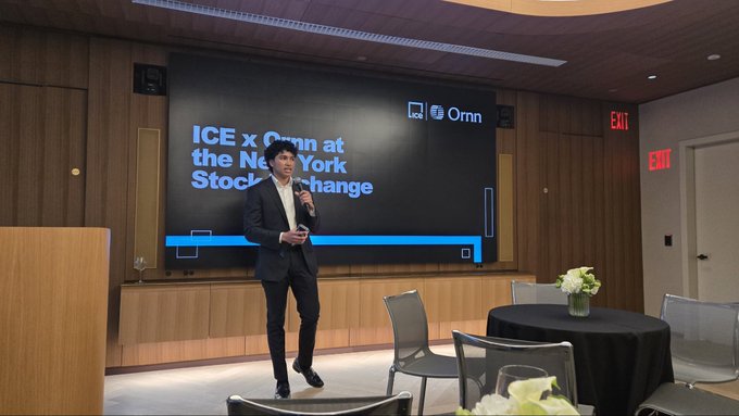 A man in a suit speaks at a podium in front of a screen displaying "ICE x Onn at the New York Stock Exchange" alongside the Onn logo, capturing the moment of the partnership announcement with NYSE and ICE highlighted in the post.
