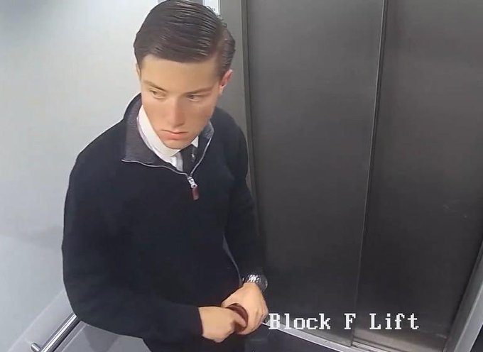 iced coffee in a black cup with white logo, "BLOCK F LIFT" on the side, and a man's face wearing a tie.