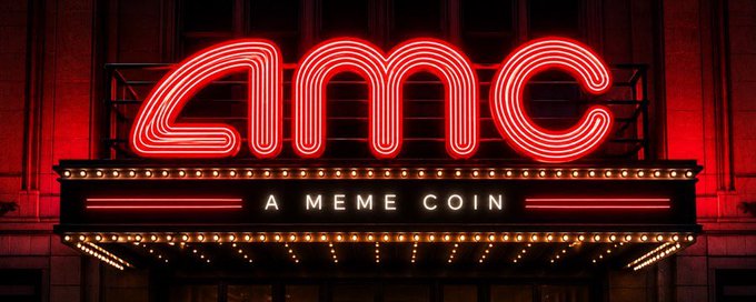 A neon sign displaying 'AMC' in red lights with the subtitle 'A MEME COIN' underneath, styled to resemble a classic movie theater marquee.