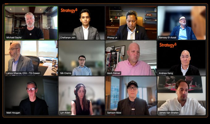 A video conference grid displays 12 participants, with name labels including Michael Saylor, Chaitanya Jain, Phong Le, and Samson Mow, set against 'Strategy' branded backgrounds.