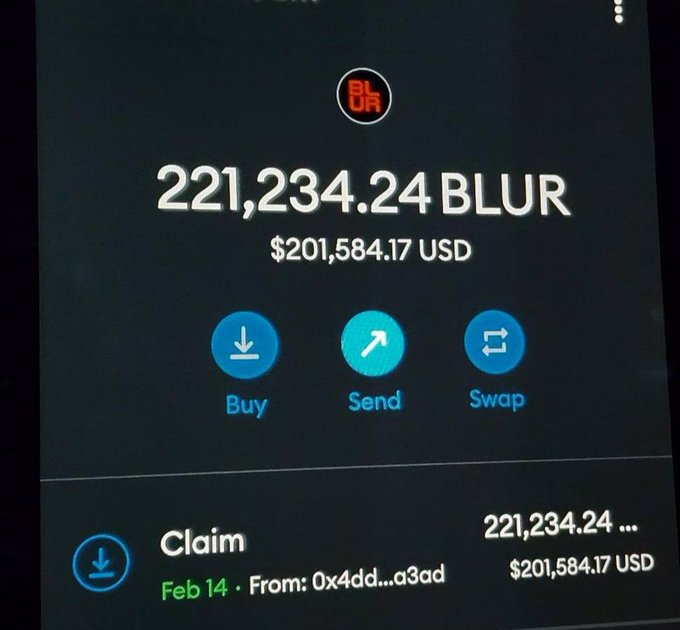 A phone screen shows a crypto wallet displaying a balance of 221,234.24 BLUR ($201,584.17 USD) with a pending claim transaction from address 0x4dd...a3ad dated Feb 14. The image illustrates the post's point about Blur's generous airdrop to active NFT traders, showing a substantial payout well within the $50K–$400K range mentioned.