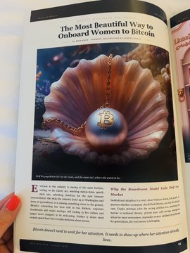 A magazine page featuring an article titled 'The Most Beautiful Way to Onboard Women to Bitcoin' by Sharon Brown, showing a photo of a Bitcoin-themed pendant necklace resting on a pink seashell.