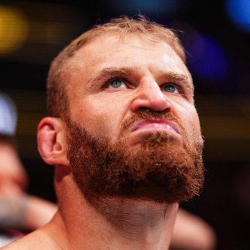 A close-up of a bearded, sweaty fighter with short hair looks upward with an intense expression. The image likely depicts Jan Blachowicz, the fighter referenced in the post, following a bout, in connection with a $4,500 bet placed on his victory over Navajo Stirling on Polymarket.