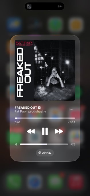 An iPhone lock screen shows the song 'Freaked Out' by Fat Papi playing via Apple Music, displayed as a Dynamic Island music player.