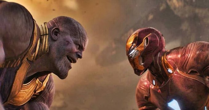 A battle-scarred Thanos stares down a battered Iron Man in their iconic Avengers: Endgame showdown, perfectly illustrating the post's contrast between Iron Man's emotional farewell and Thanos's hypothetical massive 3000X return on $ANSEM.