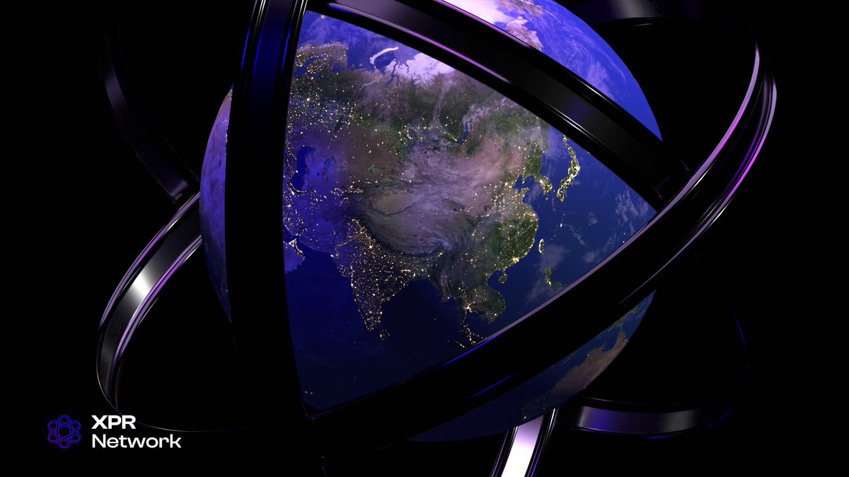 The image features a 3D rendering of the Earth, with its continents and oceans clearly visible. It's positioned at the center of three rings that are black and purple in color. The text "World wide decentralized computer @XPRNetwork" is written below the image, indicating that it might be related to a discussion or project about XPR Networking.

The Earth appears to be floating in space, with its position relative to the rings suggesting that it's not actually on Earth but rather inside these rings. The overall composition of the image creates an interesting and unique perspective on the planet.
