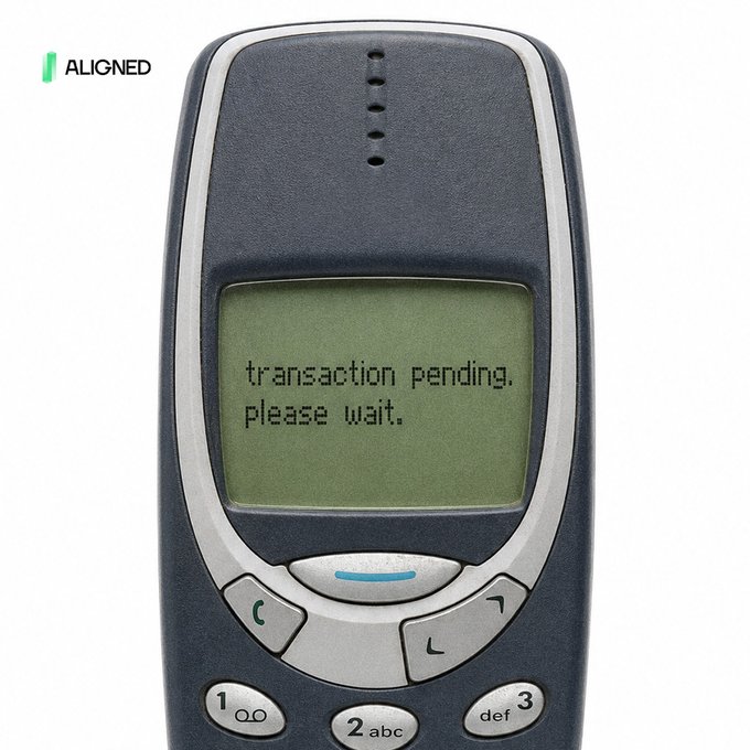 An old Nokia mobile phone with its screen displaying the message 'transaction pending. please wait.'
