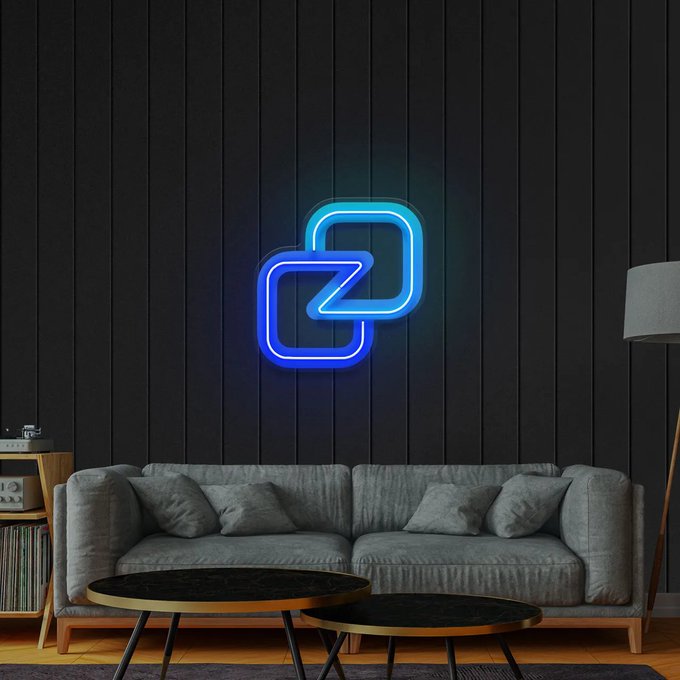 An interior scene featuring a glowing blue neon sign with a geometric double-square logo mounted on a dark wood-paneled wall above a gray sofa and round coffee tables.