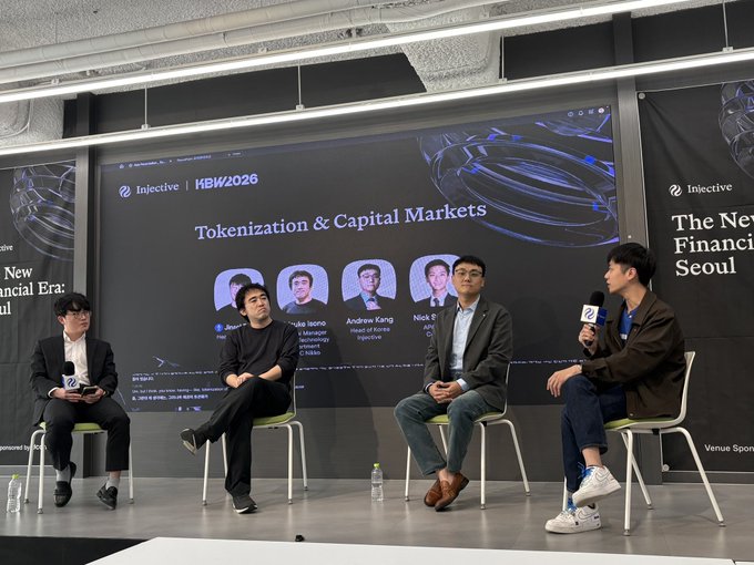 A panel discussion titled 'Tokenization & Capital Markets' at 'KBW2026' in Seoul, featuring speakers associated with 'Injective' seated on stage.
