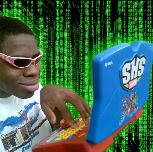 A man wearing pink sunglasses types on a VTech SHS laptop against a green Matrix-style digital rain background.