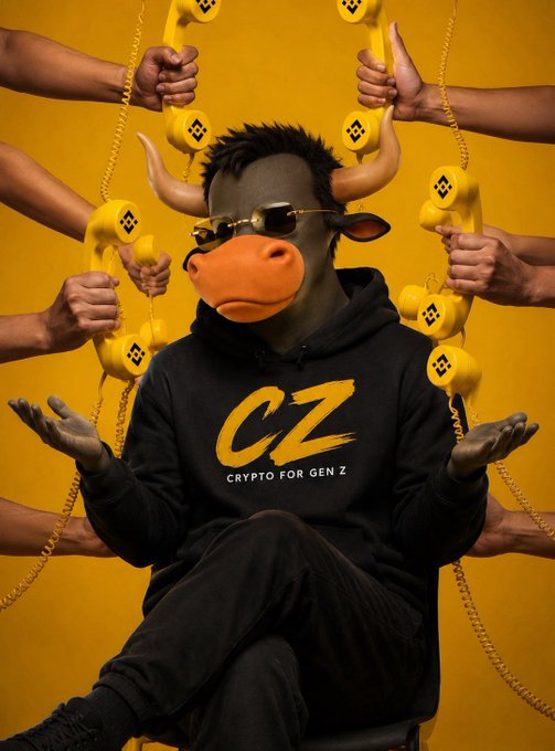 An AI-generated image shows a figure wearing a black hoodie with 'CZ - CRYPTO FOR GEN Z' text, a bull mask, and sunglasses, surrounded by multiple hands holding yellow Binance-style telephones.