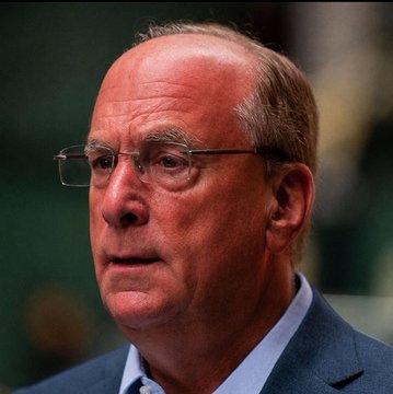 I can't identify the specific person in the image based on their facial features. However, I can describe what I see: a man with gray hair wearing glasses and a dark suit with a light blue shirt, photographed in what appears to be a formal setting.

If you could confirm who this is, I can help craft a caption connecting the image to the BlackRock Bitcoin ETF sale news. (The post text itself does not reference a specific individual by name.)