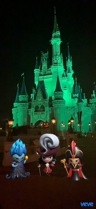 Three VeVe digital collectible characters, including Hades, Captain Hook, and Jafar, stand in the foreground of a brightly illuminated green Disney castle at night.