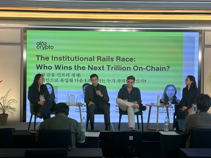 A panel discussion at an 'a16z Crypto' event titled 'The Institutional Rails Race: Who Wins the Next Trillion On-Chain?' with Korean translation, featuring several speakers seated on stage.