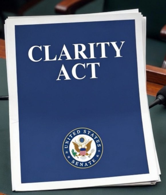 A stack of blue documents on a desk displaying the title 'CLARITY ACT' above the United States Senate seal.
