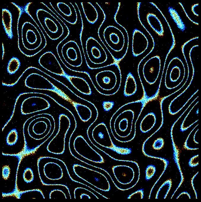 An abstract psychedelic pattern featuring swirling blue and cyan glowing contour lines on a black background with colorful noise speckles.