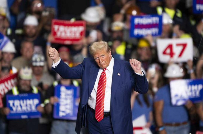 The user wants a caption for the image.
The image shows Donald Trump at a rally, raising his fists, with a crowd holding signs.
Key text visible in the image:
- "TRUMP PENCE" (on blue signs)
- "FIGHT! FIGHT!" (on blue signs)
- "47" (on a white sign)
- "TRUMP VARGE" (on a red sign, though partially obscured, looks like "TRUMP PENCE" or similar, actually looking closer at the red sign behind him, it says "TRUMP PENCE" but the text is blurry. Wait, let's look at the blue signs. One says "TRUMP PENCE". Another blue sign says "TRUMP PENCE". A red sign says "TRUMP PENCE" - wait, no, the red sign says "TRUMP PENCE" but the letters are blurry. Actually, looking at the red sign behind his right shoulder, it says "TR