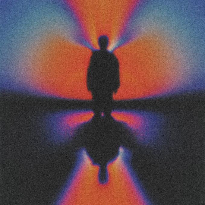 An artistic digital illustration depicts a dark silhouetted figure standing on a reflective surface, with vibrant orange and blue glowing energy radiating from behind their head and mirroring below.