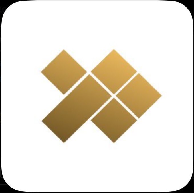 A gold geometric logo consisting of four diamond shapes arranged in an abstract pattern on a white background, appearing to be the MetaMask logo.
