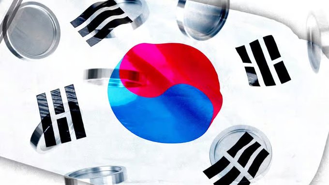 A stylized 3D rendering displays the South Korean flag (Taegeukgi) wrapped around curved silver cylindrical objects against a cloudy sky background.