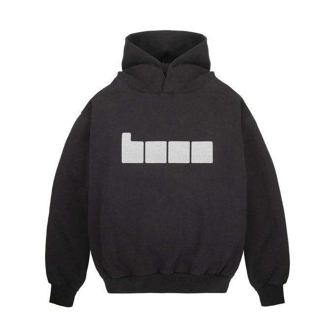 A black hoodie with a white "boum" logo (four rectangular blocks) displayed on the chest. The post references @baseapp (Base), an Ethereum layer-2 network associated with Coinbase, suggesting the hoodie is a promotional item from the platform being offered as a reward.