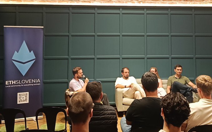 A panel discussion at an event labeled 'ETHSLOVENIA' with the tagline 'Local community for everything onchain', showing four panelists seated on stage addressing an audience.