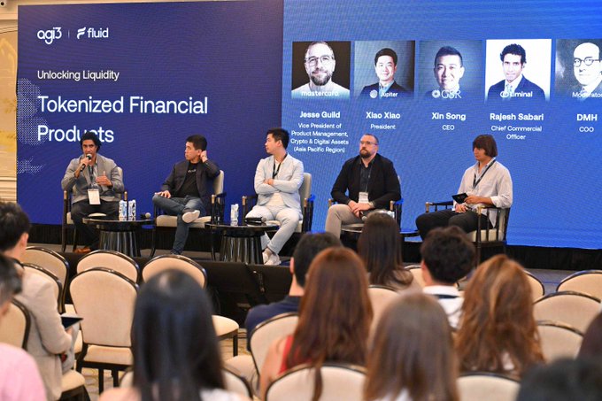 A panel discussion at the "Re-DeFining Finance" event titled "Unlocking Liquidity: Tokenized Financial Products," featuring speakers Jesse Guild (Mastercard), Xiao Xiao (Jupiter), Xin Song (GSR), Rajesh Sabari (Liminal), and DMH, with a moderator engaging the audience.
