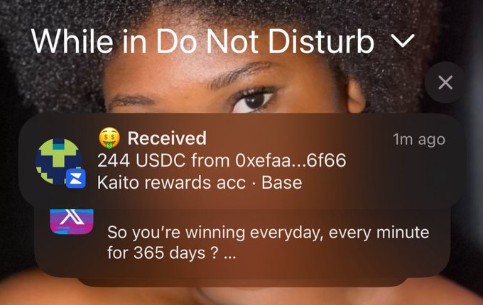 A phone notification under "Do Not Disturb" mode shows a received transaction of "244 USDC from 0xefaa...6f66" labeled "Kaito rewards acc · Base" alongside a message reading "So you're winning everyday, every minute for 365 days? …". This visually confirms the post's claim of a first payment from Wallchain, highlighting the USDC crypto earnings secured by the user.