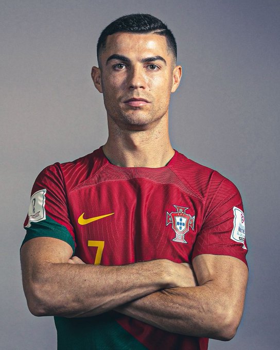 Professional headshot of Cristiano Ronaldo in a red Portugal national team jersey featuring the number 7, the Portuguese Football Federation crest, and the Nike logo, with his arms crossed against a gray background. The image ties into the post's promotion of a "$CR7" cryptocurrency token using Ronaldo's likeness and iconic #7 branding, despite the official-looking appearance suggesting an endorsement.