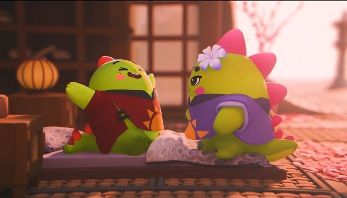 A 3D rendered scene featuring two cute green dinosaur characters sitting on cushions in a warmly lit room with a lantern and pink flowers in the background.