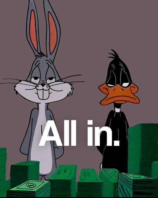 Bugs Bunny and Daffy Duck from Looney Tunes stand behind stacks of money, with the text 'All in.' displayed across the center.