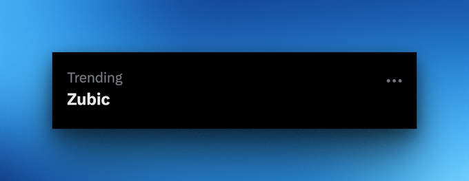 A dark notification card on a blue gradient background displays the text 'Trending' and 'Zubic' with an ellipsis menu.