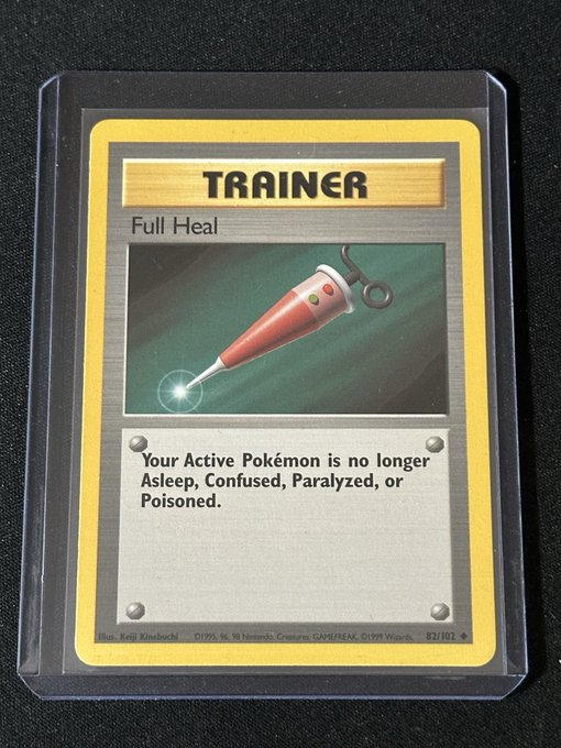 A Pokémon Trainer card titled 'Full Heal' from the Base Set (82/102), illustrated by Keiji Kinebuchi, depicting a red syringe-like healing tool.