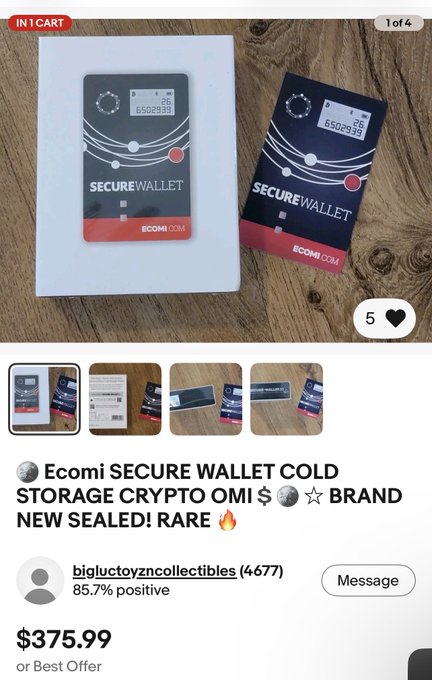 A sealed Ecomi Secure Wallet is listed on eBay for $375.99 by seller "bigluctoyzncollectibles" (85.7% positive feedback), shown with its packaging and branded "ECOMI.COM" with a serial number visible (6502939).