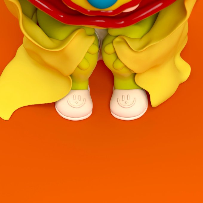 Close-up of designer toy figure's lower half showing yellow pants, white shoes with smiley faces, a red lip element, against a solid orange background.