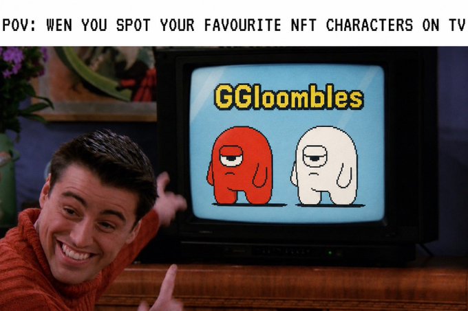 A meme captioned 'POV: WEN YOU SPOT YOUR FAVOURITE NFT CHARACTERS ON TV', showing Frankie Muniz excitedly pointing at a TV displaying two cartoon characters labeled 'GGloombles'.