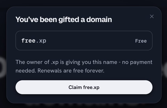 A dark UI popup dialog stating 'You've been g gifted a domain' for 'free.xp,' noting that renewals are free forever, with a 'Claim free.xp' button.