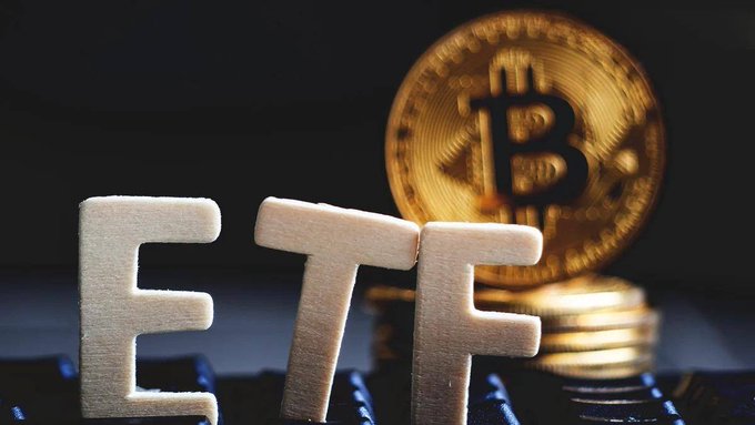 The letters 'ETF' made of foam stand in front of a gold Bitcoin coin and a stack of additional coins, symbolizing the concept of a Bitcoin ETF.