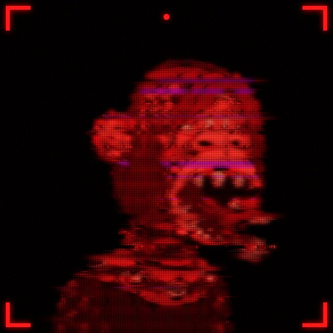 A dark, glitchy, red-toned digital image depicting a distorted, monstrous face with teeth, framed by camera viewfinder markings.