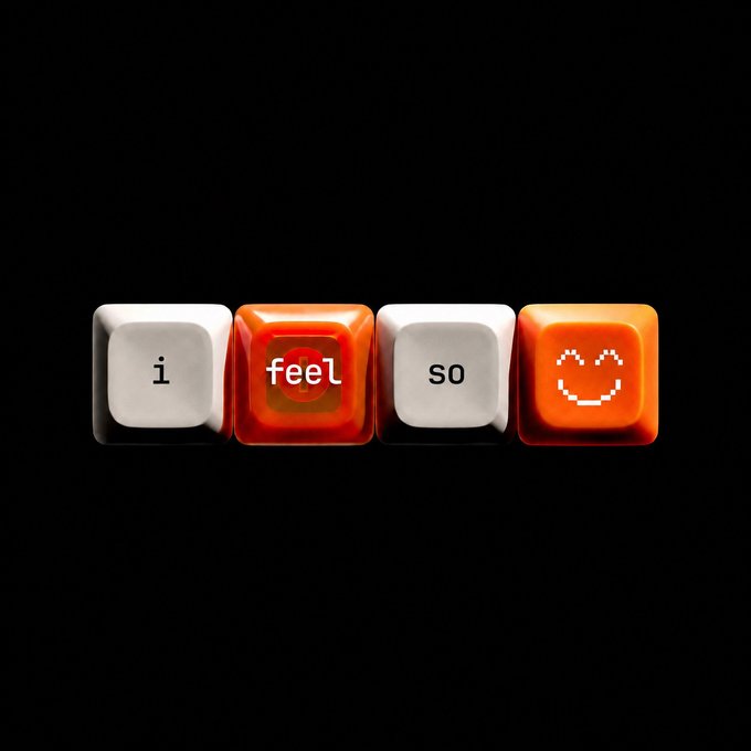 Four keycaps on a black background spelling out 'i feel so' with a smiley face on the final orange keycap.