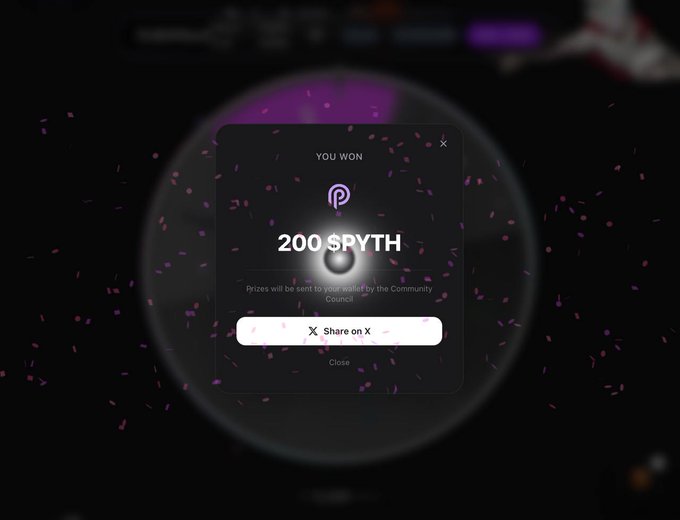 The image shows a screen with a purple background, displaying an advertisement for a game called "PythWheel". The advertisement features a large purple circle with a black dot inside, surrounded by pink confetti. The text on the screen reads "You won 200 Spyth", indicating that someone has won a prize of 200 spins in the game.