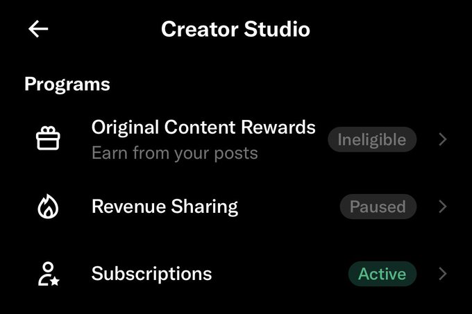 The image shows a Creator Studio interface displaying three Programs: "Original Content Rewards" (marked Ineligible), "Revenue Sharing" (marked Paused), and "Subscriptions" (marked Active). The post "Free degenBRO!" plays on the irony of the creator offering something for free while their monetization programs are either paused or ineligible, with only Subscriptions remaining active.