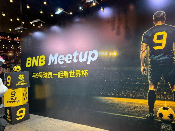 A promotional banner for 'BNB Meetup' featuring a soccer player wearing jersey number 9, with Chinese text reading '与9号球员一起看世界杯' (Watch the World Cup with Player No. 9), accompanied by branded boxes with the BNB Meetup logo.