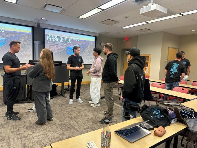 Tangem team members engage with students in a classroom setting during a presentation on "The Rise of Crypto in the AI Era," with one team member's shirt displaying a list of currencies that includes "ICP," reinforcing the brand's global efforts in promoting self-custody education.