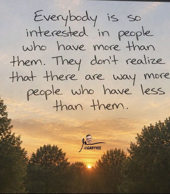 An inspirational quote by @garyvee over a sunset sky: 'Everybody is so interested in people who have more than them. They don't realize that there are way more people who have less than them.'
